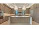 Bright kitchen showcasing a center island, abundant cabinetry, and high-end finishes at 670 Old Compass Rd, Longboat Key, FL 34228
