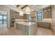 Gourmet kitchen featuring an island, custom cabinets, and stainless steel appliances, waterfront view at 670 Old Compass Rd, Longboat Key, FL 34228