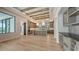 Open kitchen boasts an expansive island, custom cabinetry, and designer lighting fixtures at 670 Old Compass Rd, Longboat Key, FL 34228