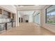 Elegant living room featuring a stylish bar area, fireplace, and plenty of natural light at 670 Old Compass Rd, Longboat Key, FL 34228