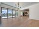 Open-concept living room with water views, a fireplace, and hardwood flooring at 670 Old Compass Rd, Longboat Key, FL 34228