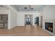 Spacious living room with hardwood floors, fireplace, and modern lighting fixtures at 670 Old Compass Rd, Longboat Key, FL 34228