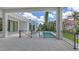 Outdoor covered patio has plenty of room, a plunge pool and water views at 670 Old Compass Rd, Longboat Key, FL 34228