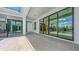The covered patio boasts recessed lighting, plenty of room for entertaining and access to the outdoors at 670 Old Compass Rd, Longboat Key, FL 34228