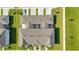 Aerial rooftop view of townhomes with private, screened lanais and manicured lawn at 7352 Cabin Ln, Sarasota, FL 34240