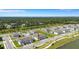 Birds eye view of the property, neighborhood, with lush green surroundings and an inviting lake nearby at 7352 Cabin Ln, Sarasota, FL 34240