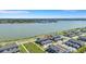 Beautiful aerial view of community townhomes with lake view, lush landscaping, and charming street layouts at 7352 Cabin Ln, Sarasota, FL 34240