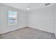 Neutral bedroom with carpet, ceiling fan, and water view window at 7352 Cabin Ln, Sarasota, FL 34240