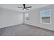 Bright bedroom with large windows offering natural light and comfortable carpet flooring at 7352 Cabin Ln, Sarasota, FL 34240