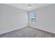 Bright bedroom with neutral carpet and one window at 7352 Cabin Ln, Sarasota, FL 34240