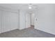 Spacious bedroom with double closets, ceiling fan and neutral carpet at 7352 Cabin Ln, Sarasota, FL 34240