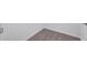 Close-up of carpeted corner with white trim against clean white walls at 7352 Cabin Ln, Sarasota, FL 34240