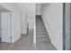 Bright entryway featuring tile floors, a staircase, and access to various rooms, creating a welcoming atmosphere at 7352 Cabin Ln, Sarasota, FL 34240