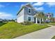 Attractive two-story townhome featuring well-maintained lawn and inviting street view at 7352 Cabin Ln, Sarasota, FL 34240