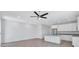 Bright and open living area with recessed lighting, ceiling fan, and sleek tiled floors at 7352 Cabin Ln, Sarasota, FL 34240