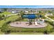 An aerial shot of the community's playground with slides, swings, and climbing features at 7352 Cabin Ln, Sarasota, FL 34240