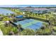 A top-down shot featuring a community playground with a climbing wall and pickleball courts at 7352 Cabin Ln, Sarasota, FL 34240