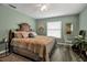 Cozy bedroom with a wooden headboard, comfortable bed, and a desk area for work or study at 7404 14Th W Ave, Bradenton, FL 34209