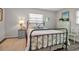 A cozy bedroom featuring a stylish bed frame, flamingo lamp, and dresser create a comfortable and inviting atmosphere at 7404 14Th W Ave, Bradenton, FL 34209