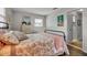 The bedroom has a double bed, white closet doors, and a view into the en suite bathroom with stylish decorative touches at 7404 14Th W Ave, Bradenton, FL 34209