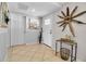 Bright foyer featuring decorative accents, neutral walls, and ceramic tile floors at 7404 14Th W Ave, Bradenton, FL 34209