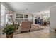 Spacious living room with dining area, featuring tile floors and plenty of natural light at 7404 14Th W Ave, Bradenton, FL 34209