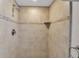 The shower showcases neutral tiled walls, decorative accent tiles, and modern fixtures for a luxurious bathing experience at 7404 14Th W Ave, Bradenton, FL 34209