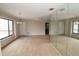 Spacious living room with neutral carpet and large windows for natural light at 753 Tropical Cir, Sarasota, FL 34242
