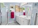 Bright bathroom with a double sink vanity, a glass enclosed shower, and modern lighting at 7747 33Rd E St, Sarasota, FL 34243