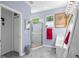 Bright bathroom featuring dual sinks, gray marble flooring, and glass shower in a home for sale at 7747 33Rd E St, Sarasota, FL 34243