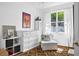 Bedroom featuring a large window with natural light, a white dresser, and a decorative rug at 7747 33Rd E St, Sarasota, FL 34243
