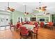 A spacious dining room showcases elegant ceiling fans, tables, and comfortable seating for residents and guests alike at 7747 33Rd E St, Sarasota, FL 34243