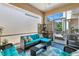 Inviting screened-in porch with comfortable seating and stylish decor, perfect for outdoor relaxation at 7747 33Rd E St, Sarasota, FL 34243