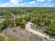 Scenic aerial shot featuring the property and its beautifully wooded surroundings at 8146 Tropicaire Blvd, North Port, FL 34291