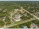 Extensive aerial perspective highlighting the property's layout and surrounding natural environment at 8146 Tropicaire Blvd, North Port, FL 34291