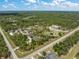 Wide aerial shot of property and surrounding neighborhoods, highlighting the area's landscape and infrastructure at 8146 Tropicaire Blvd, North Port, FL 34291
