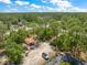 Wide aerial shot featuring the property and its beautifully wooded surroundings at 8146 Tropicaire Blvd, North Port, FL 34291