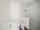 A sleek bathroom featuring a shower, vanity, and toilet at 8146 Tropicaire Blvd, North Port, FL 34291