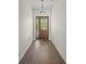 Entryway with dark wooden floors and front door at 8146 Tropicaire Blvd, North Port, FL 34291