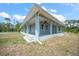 Inviting exterior showcasing a covered porch with substantial columns and ample natural light at 8146 Tropicaire Blvd, North Port, FL 34291