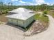 Three car garage with durable metal roof on land at 8146 Tropicaire Blvd, North Port, FL 34291