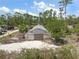 A greenhouse on a lot of land provides space for growing plants in a controlled environment at 8146 Tropicaire Blvd, North Port, FL 34291