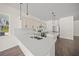 Bright eat-in kitchen with stainless steel appliances and island at 8146 Tropicaire Blvd, North Port, FL 34291