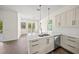 Eat-in kitchen area features stainless steel appliances and modern cabinetry at 8146 Tropicaire Blvd, North Port, FL 34291