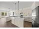 Bright kitchen features large island and stainless steel appliances at 8146 Tropicaire Blvd, North Port, FL 34291