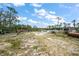 Large plot of land with equipment and storage, ready for development or agricultural use at 8146 Tropicaire Blvd, North Port, FL 34291
