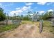 Fenced-in land with mature trees at 8146 Tropicaire Blvd, North Port, FL 34291