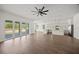 Open-concept living area with wood-look floors and bright, airy atmosphere at 8146 Tropicaire Blvd, North Port, FL 34291