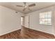 This bedroom offers hardwood floors and natural light with an adjacent doorway for easy access at 1030 Villagio Cir # 103, Sarasota, FL 34237