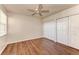 This bedroom features hardwood floors, ample natural light, and closet space for optimal storage at 1030 Villagio Cir # 103, Sarasota, FL 34237